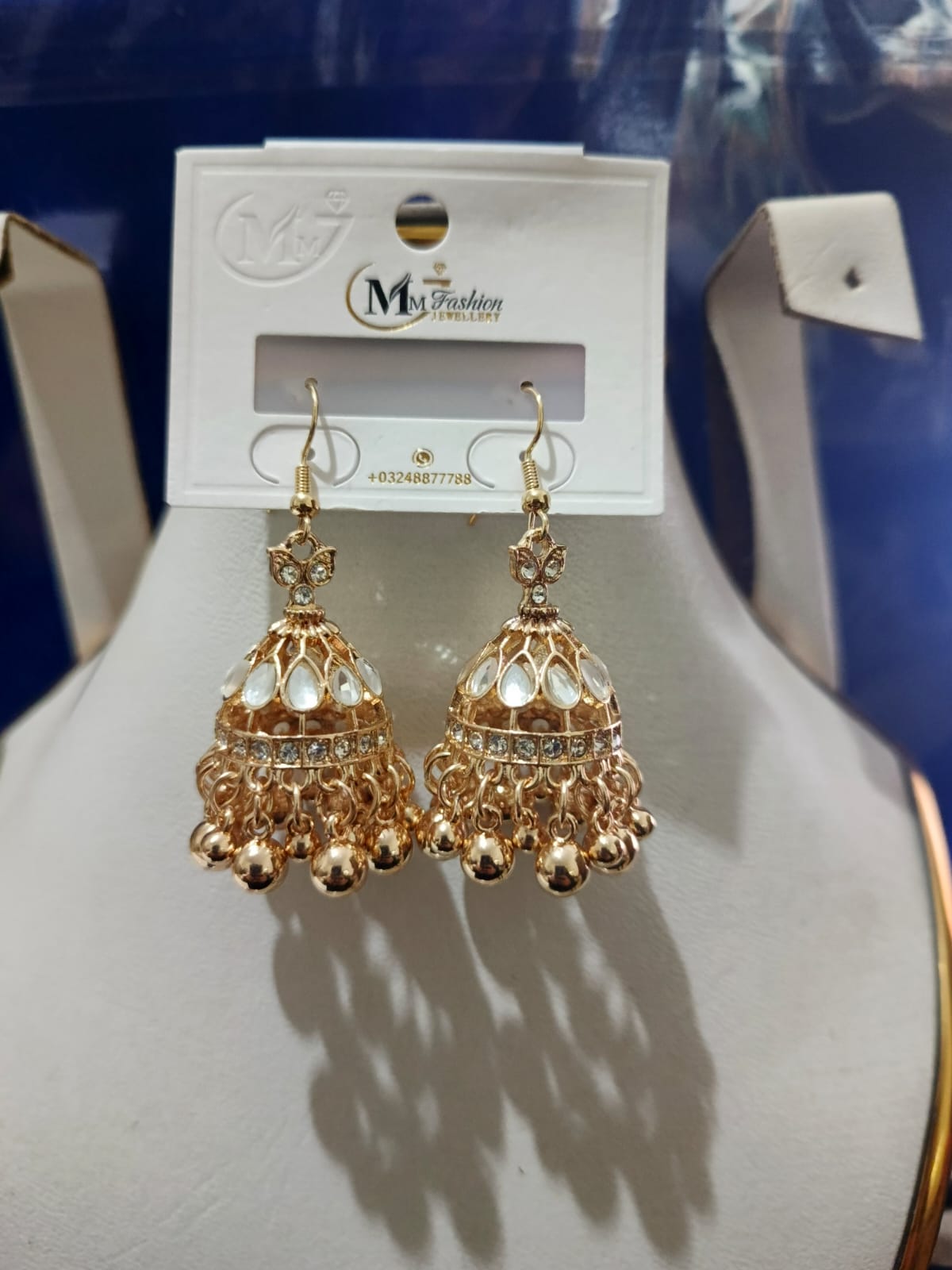 Traditional Gold Jhumka Earrings with Pearl and Crystal Design