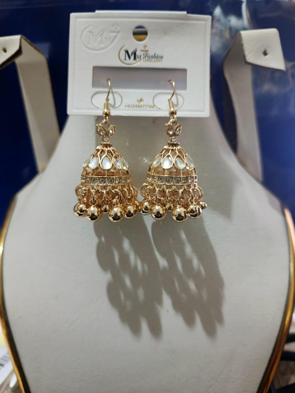 Traditional Gold Jhumka Earrings with Pearl and Crystal Design